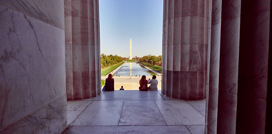 A photograph from the inside of the Lincoln Memorial looking out at the Washington Monument in Washington, DC, USA.